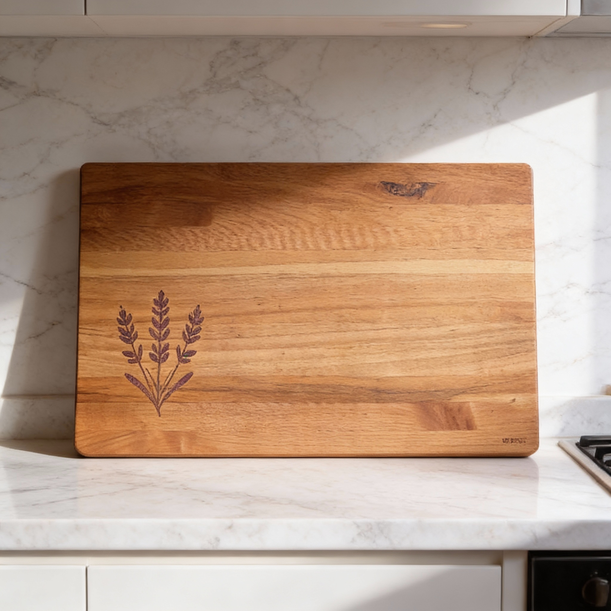 Wooden cutting board with engraved design on a marble countertop